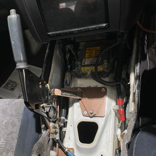 Close-up of a car's interior with tools and wiring visible